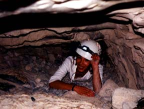 Christel slips in through the cave entrance